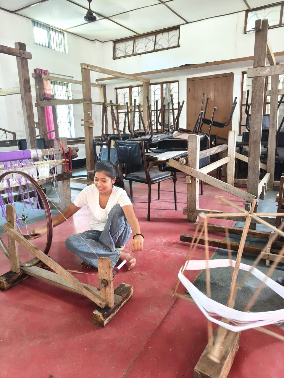 Trainee with a handwoven fabric